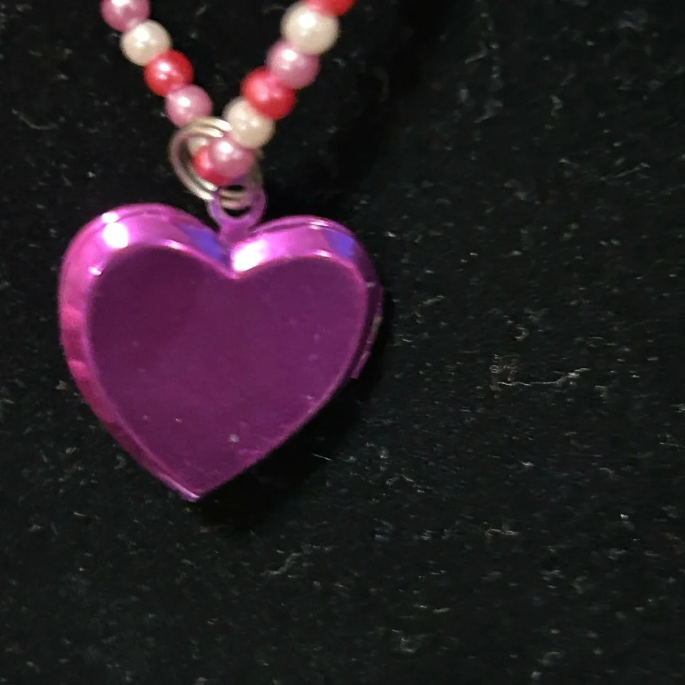 Pink and white beaded necklace with Dora the Explorer locket